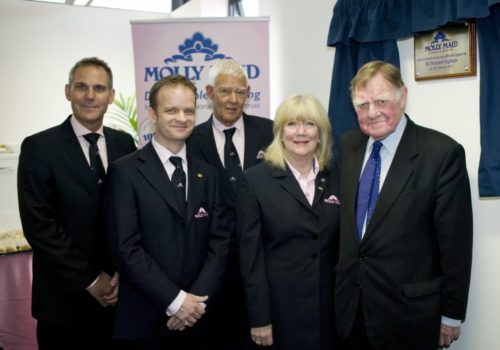 MOLLY MAID Owner and directors with Sir Bernard Ingham